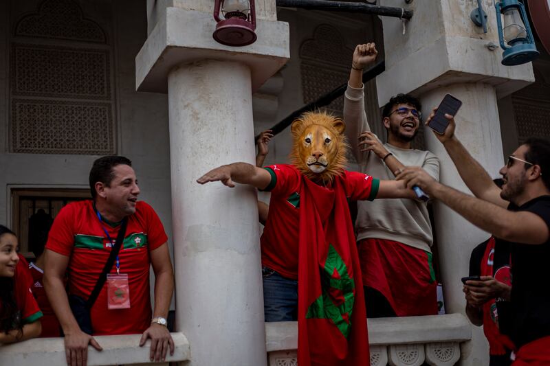 Fans of Morocco cheer at the Souq Waqif market in Doha, Qatar, before their World Cup quarter-final match against Portugal. EPA