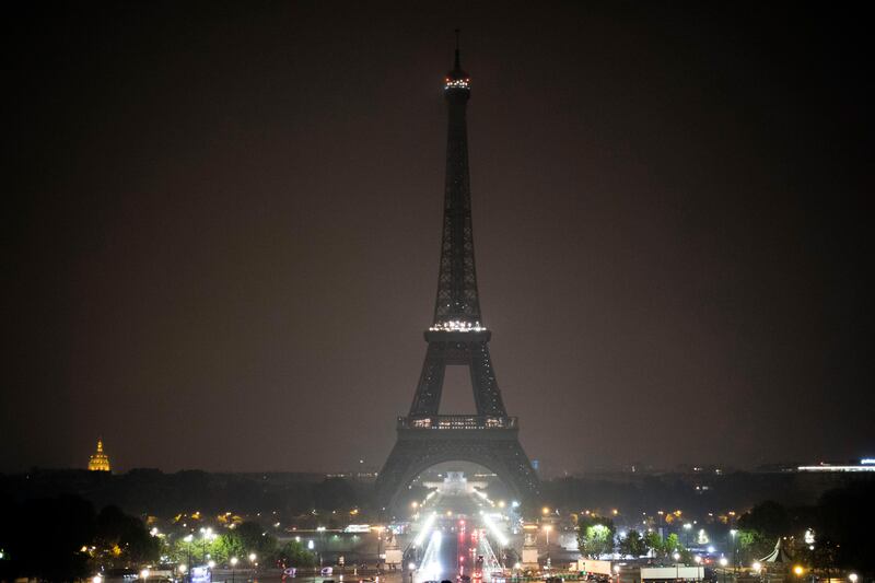 The Eiffel tower is seen with its lights turned off in Paris, France, on Monday, October 2, 2017. Paris mayor Anne Hidalgo said the Eiffel tower would turn off its lights Monday at midnight Paris hour to pay tribute to Las Vegas and Marseille victims. Kamil Zihnioglu / AP Photo