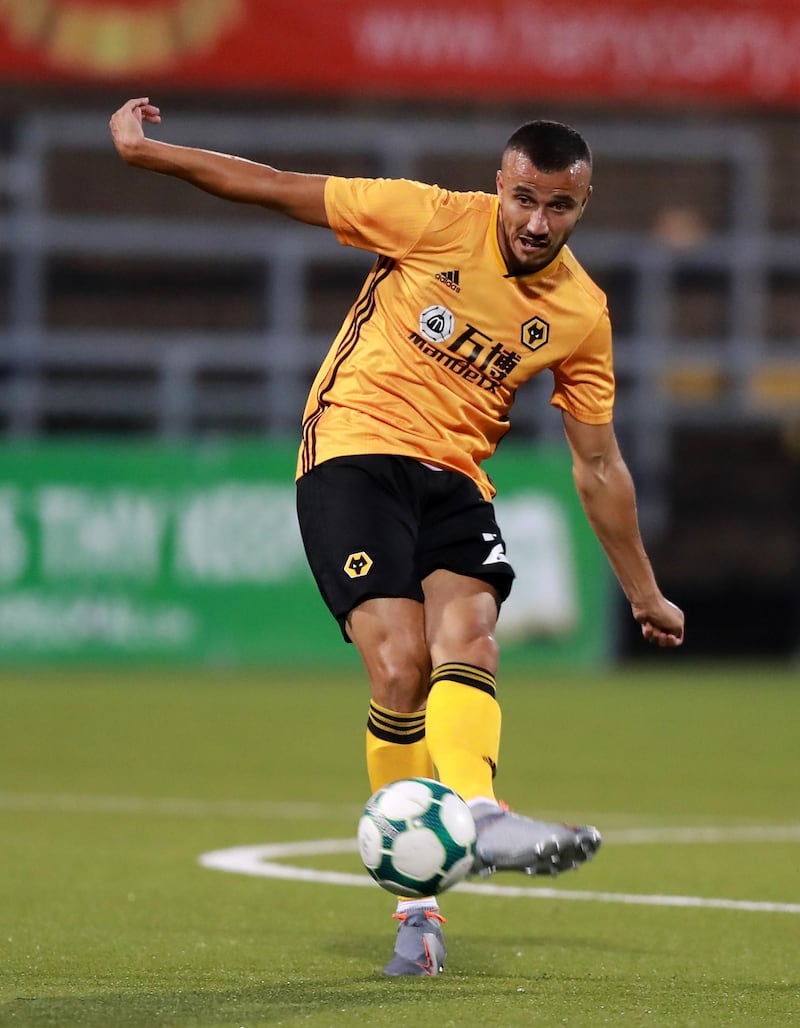BELFAST, NORTHERN IRELAND - AUGUST 01:  Romain Saiss of Wolverhampton Wanderers passes the ball during the UEFA Europa League Second Qualifying round 2nd Leg match between Crusaders and Wolverhampton Wanderers at Seaview Stadium on August 01, 2019 in Belfast, Northern Ireland. (Photo by David Rogers/Getty Images)
