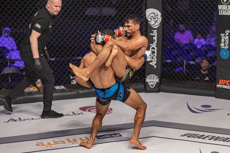 Hussein Salem attempts a choke on Nizar Ben Amara. 