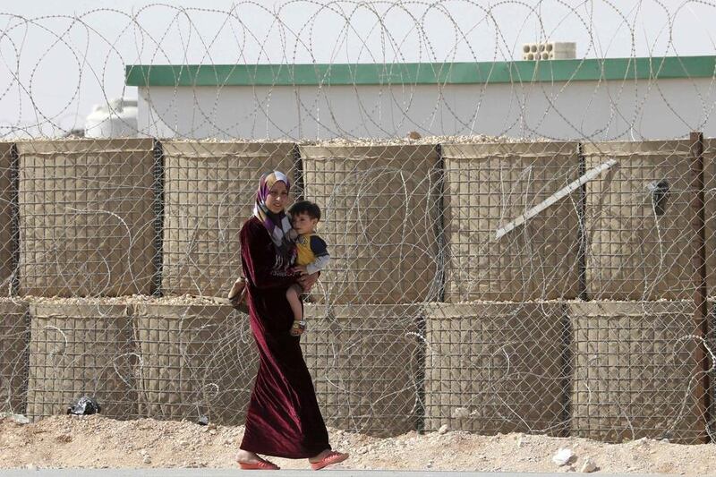 Fighting in Syria’s civil war has displaced millions of people, including this woman and child at the Zaatari refugee camp in the Jordanian city of Mafraq, near the border with Syria. Muhammad Hamed / Reuters / May 4, 2014