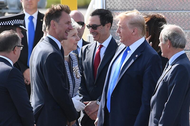 Foreign Secretary Jeremy Hunt  tells US President Donald Trump the UK will "put on a fantastic show" for him as he arrives at Stansted Airport in London, England.  Getty