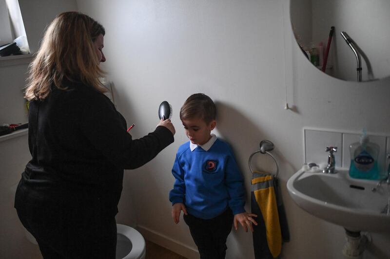 Fraser Mcintosh, 5, is seen getting ready for school in Lossiemouth, Scotland. Scotland's youngest primary school pupils are returning on Monday for the first time since the Christmas holiday. Getty Images