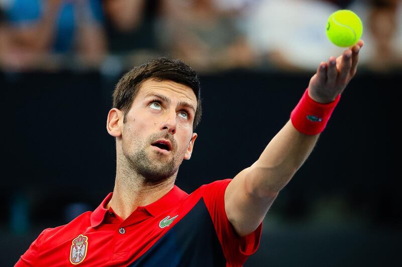 TOPSHOT - Novak Djokovic of Serbia serves against Cristian Garin of Chile during the men's singles match on day six of the ATP Cup tennis tournament in Brisbane on January 8, 2020. -- IMAGE RESTRICTED TO EDITORIAL USE - STRICTLY NO COMMERCIAL USE --
 / AFP / AFP  / Patrick HAMILTON / -- IMAGE RESTRICTED TO EDITORIAL USE - STRICTLY NO COMMERCIAL USE --
