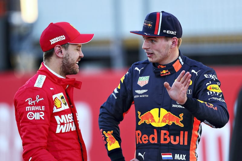 AUSTIN, TEXAS - NOVEMBER 02: Second place qualifier Sebastian Vettel of Germany and Ferrari talks with third place qualifier Max Verstappen of Netherlands and Red Bull Racing in parc ferme during qualifying for the F1 Grand Prix of USA at Circuit of The Americas on November 02, 2019 in Austin, Texas.   Dan Istitene/Getty Images/AFP