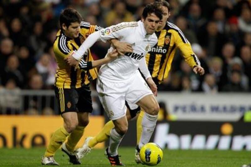 Real Madrid's Kaka, center, between Zaragoza's Javier Paredes, left, and Timislav Dujmovic, was happy with the win but feels his side "can't always have to rally to win and concede so many goals".