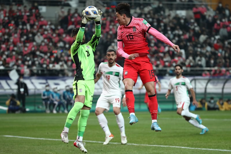 Hwang Ui-Jo of South Korea challenges Iran goalkeeper Amir Abed Zadeh. Getty