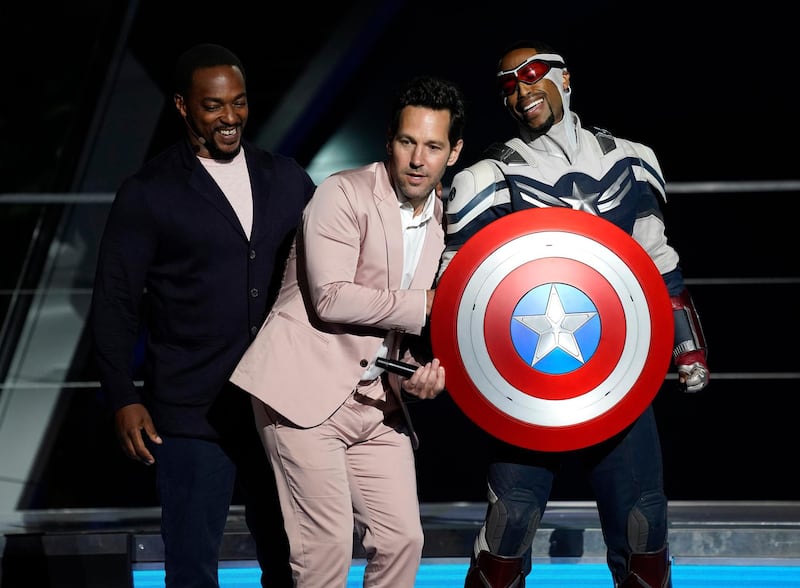 Anthony Mackie, left, and his character Captain America, right, appear on stage with Paul Rudd at the Avengers Campus dedication ceremony at Disney's California Adventure Park on June 2, 2021. AP