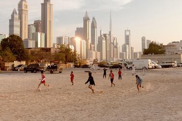 Children play football in Satwa in 2015. Alex Atack