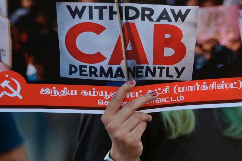 A demonstrator shouts slogans and holds a placard to protest against the Indian government's Citizenship Amendment Bill (CAB) in Chennai on December 16, 2019.  Fresh protests rocked India on December 16 as anger grew over new citizenship legislation slammed as anti-Muslim, after six people died in the northeast and up to 200 were injured in New Delhi. / AFP / Arun SANKAR                        
