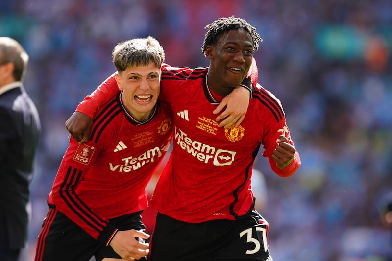 Manchester United's Alejandro Garnacho, left, and Kobbie Mainoo after winning the Emirates FA Cup final at Wembley Stadium. PA