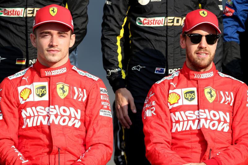 ABU DHABI, UNITED ARAB EMIRATES - DECEMBER 01: Charles Leclerc of Monaco and Ferrari and Sebastian Vettel of Germany and Ferrari  sit for the F1 Drivers Class of 2019 photo before the F1 Grand Prix of Abu Dhabi at Yas Marina Circuit on December 01, 2019 in Abu Dhabi, United Arab Emirates. (Photo by Charles Coates/Getty Images)