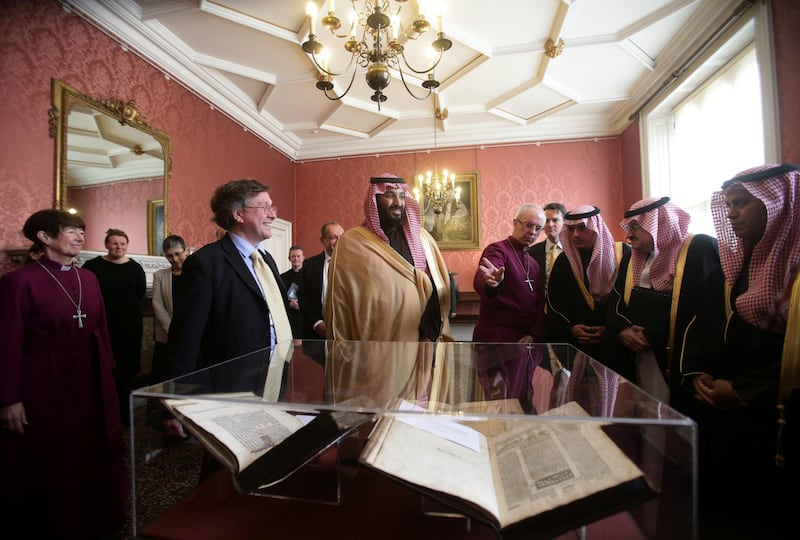 Britain's Archbishop of Canterbury Justin Welby shows The Crown Prince of Saudi Arabia Mohammed bin Salman a selection of early texts from the Christian, Muslim and Jewish faiths.