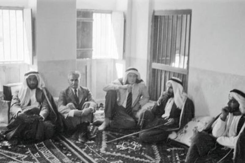 Abu Dhabi, Trucial Oman States . 1957 (date to be confimed)  Photograph shows Roddy Owen (third from right) sitting in the upstairs majlis at Qasr Al Hosn Fort. (The other western gentleman is unidentified) On the Far left is Sheikh Zayed Al Nahyan. Second right is Sheikh Shakbut Al Nahyan. Man on far right unidentified *** Local Caption *** Eds note. Karen
**Permission should be sought prior to any reproduction**  Literary executor contacts:  Charles Harding - hardingholefarm@aol.com Charles Darwent - charlesdarwent@aim.com  Credit: Literary Estate of Roderic Owen