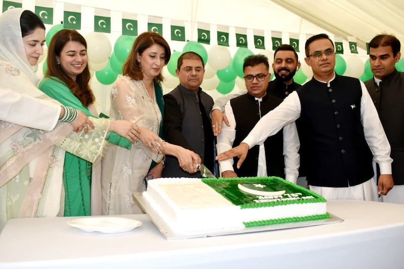Hassan Afzal Khan, centre, consul general of Pakistan, with community members at the 75-year independence day celebrations in Dubai. 