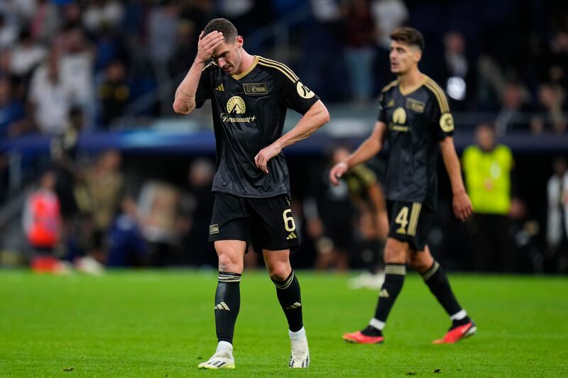 Union's Robin Gosens is dejected after Real Madrid's Jude Bellingham scored the winner. AP