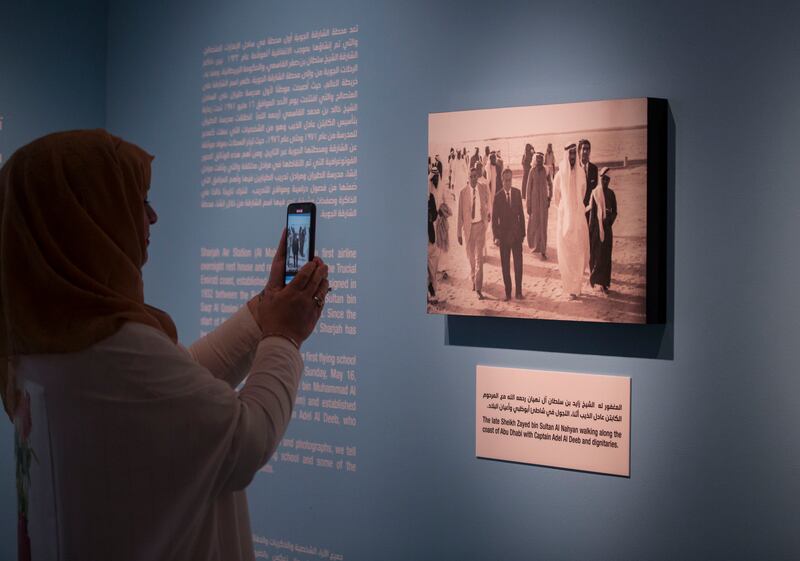 Capt Fatina Al BItar, the first woman to graduate from the UAE flying school in Sharjah, takes photos inside the museum.