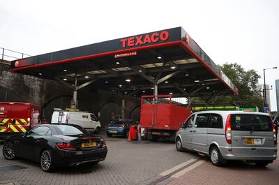 Vehicles queue to refuel in London on Thursday morning. Reuters