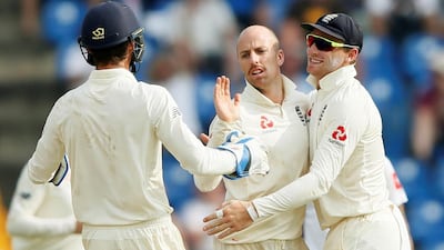 England's Jack Leach celebrates with his teammates after taking the wicket of Sri Lanka's Dilruwan Perera. Reuters