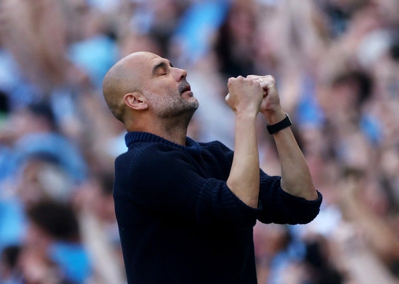 Manchester City manager Pep Guardiola celebrates their second goal scored by Phil Foden. Action Images 