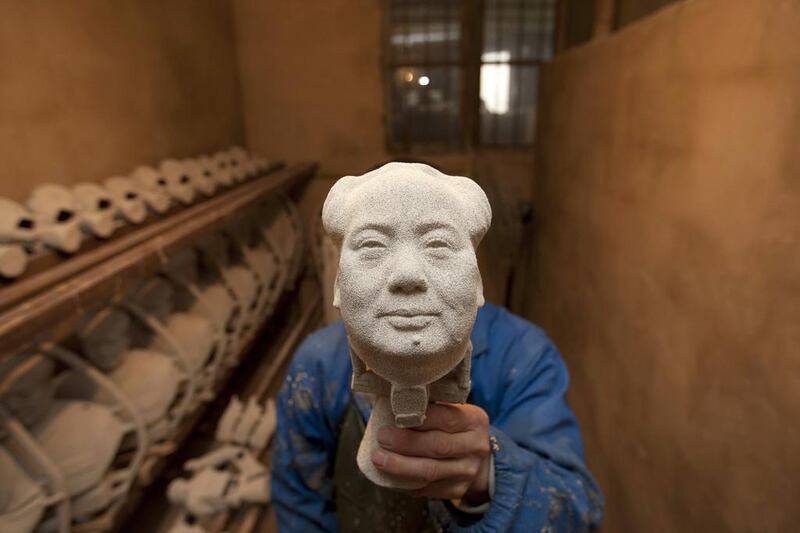 A worker makes a bronze statue of China’s late Chairman Mao Zedong at a factory in Shaoshan, Hunan province. December 26, 2014 will mark the 121st birth anniversary of Mao. Darwin Zhou / Reuters
