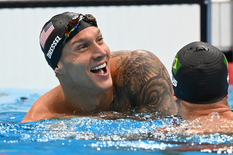 USA's Caeleb Dressel celebrate after taking gold in the final of the men's 50m freestyle.
