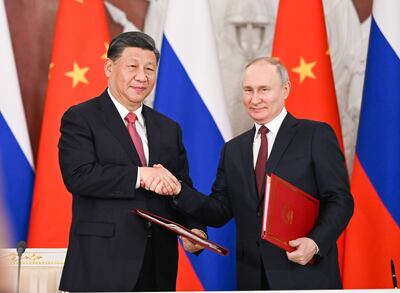 Chinese President Xi Jinping and Russian President Vladimir Putin after a meeting in Moscow last month. EPA