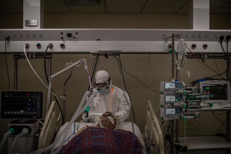 A Lebanese nurse takes care of a patient inside the Intensive Care Unit of Rafik Hariri University Hospital. Getty Images