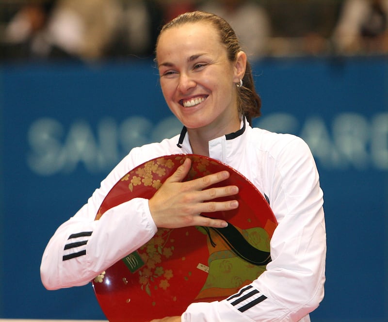TOKYO - FEBRUARY 4:   Martina Hingis of Switzerland poses with the trophy after winning her women's singles final match against Ana Ivanovic of Serbia at the Toray Pan Pacific Tournament at the Tokyo Metropolitan Gymnasium February 4, 2007 in Tokyo, Japan. (Photo by Koichi Kamoshida./Getty Images)