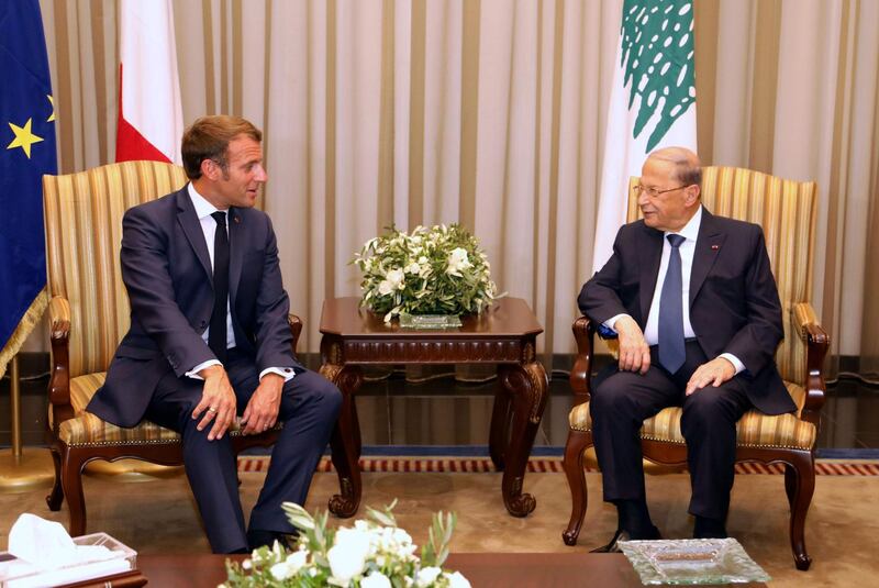 Lebanese President Michel Aoun and French President Emmanuel Macron during a welcome ceremony at Beirut airport. AFP