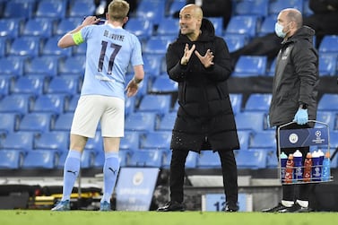 Manchester City manager Pep Guardiola talks to Kevin De Bruyne during the Champions League quarter-final first leg against Borussia Dortmund. EPA