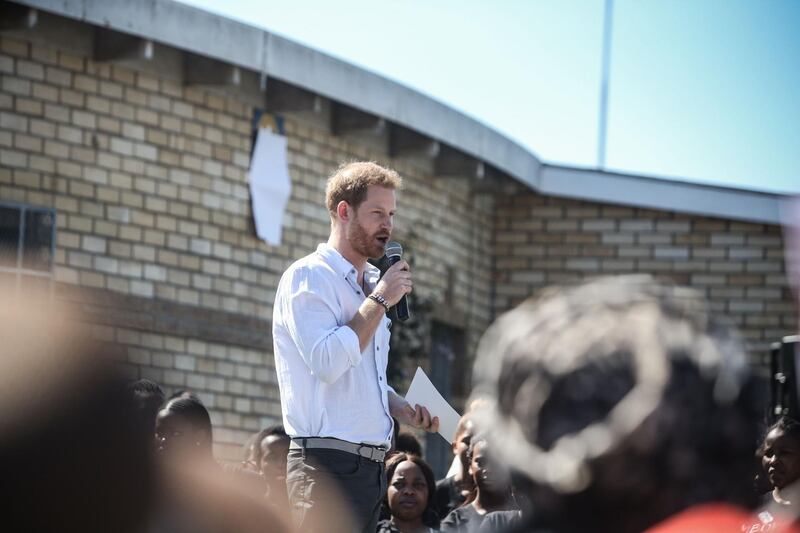 Prince Harry, Duke of Sussex gives a speech during a visit to "Justice  desk", an NGO in the township of Nyanga in Cape Town, as they begin their tour of the region on September 23, 2019. AFP