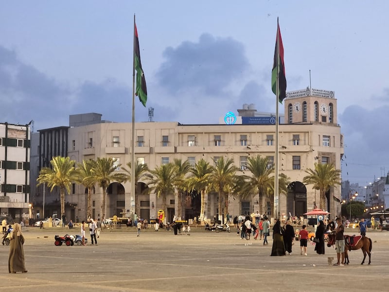 Libyan families gather in Martyrs' Square in Tripoli. AFP