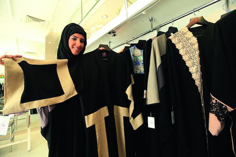 Fatma Al Mosa, Folak’s owner/designer, shows off her abayas at her shop in Abu Dhabi. Ravindranath K / The National