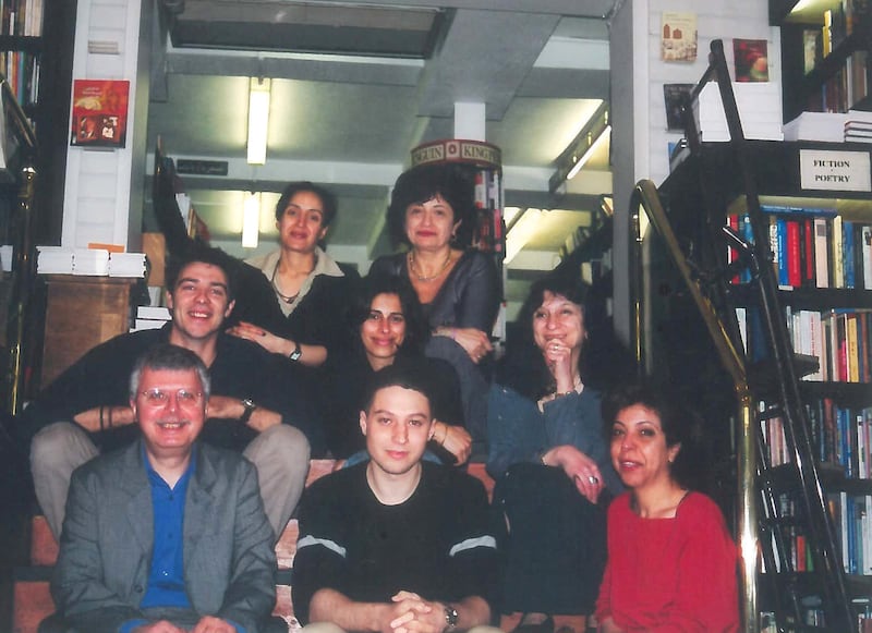 The Saqi Books team of the late Nineties, with Andre Gaspard bottom left, his wife Salwa, top right, and co-founder Mai middle row on the right. Courtesy Al Saqi Books
