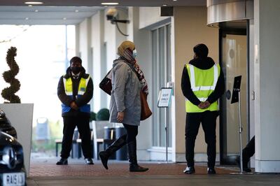 LONDON, ENGLAND - FEBRUARY 26: A traveller arrives by coach at the Holiday Inn hotel at Heathrow Airport to complete a mandatory quarantine period on February 26, 2021 in London, England. Travellers arriving in the UK from February 15 2021 onwards from countries on the "red list" of restrictions have had to isolate in hotels at airports at their own expense for ten days. (Photo by Hollie Adams/Getty Images)