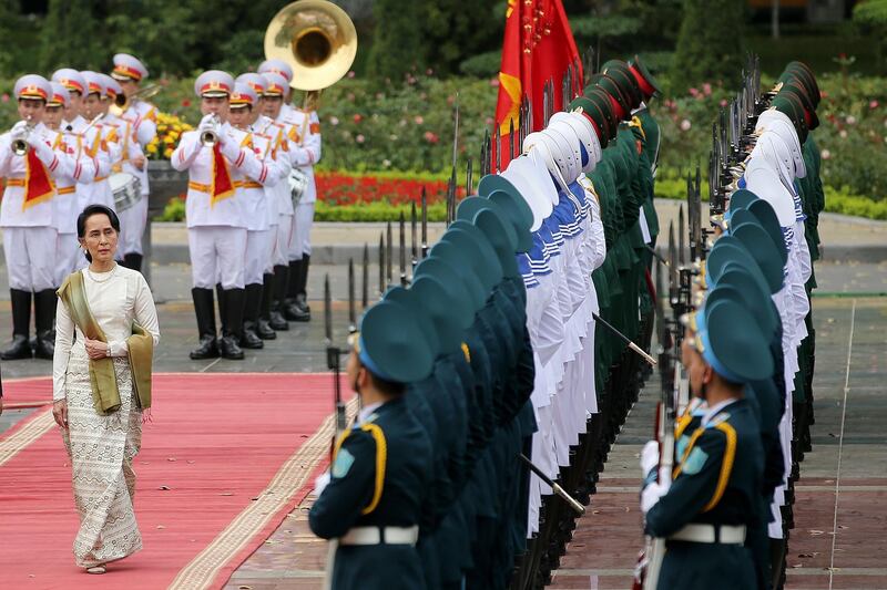 Myanmar's state counselor Aung San Suu Kyi inspects an honour guard at the Presidential Palace in Hanoi, Vietnam. Luong Thai Linh / EPA