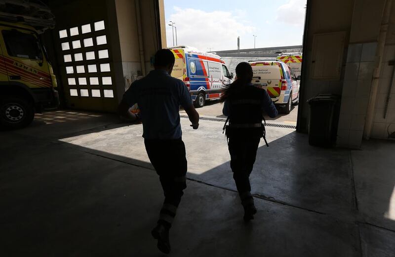 Mr Rawashdeh and Ms Book rush towards their ambulance after receiving an emergency call.