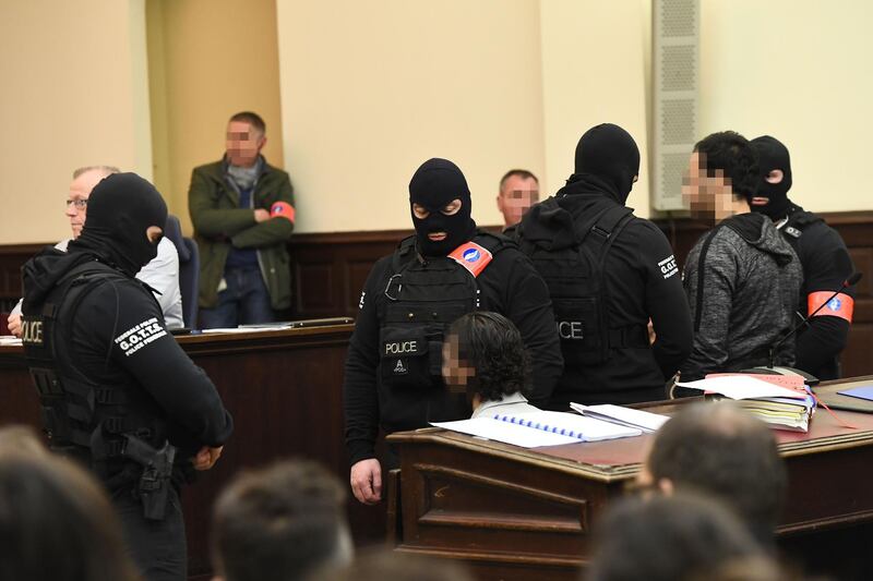 (FILES) In this file photo taken on February 5, 2018 prime suspect in the November 2015 Paris attacks Salah Abdeslam (L) sits beside his alleged accomplice Sofiane Ayari (R) as they are surrounded by Belgian special police officers in the courtroom at the "Palais de Justice" courthouse in Brussels for the opening of his trial.
The Brussels' courthouse is set to deliver on April 23, 2018, the verdict in the trial of Paris attacks suspect Salah Abdeslam and his alleged accomplice Sofiane Ayari, over March 2016 shootout with the Belgian police in Brussels, during a search that precipitated their arrest and the attacks in Brussels a week later.? / AFP PHOTO / Emmanuel DUNAND