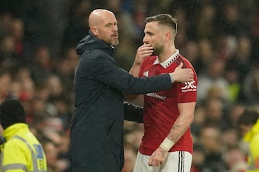 Manchester United's Luke Shaw talks to Manchester United's head coach Erik ten Hag during the English Premier League soccer match between Manchester United and Brentford, at the Old Trafford stadium in Manchester, England, Wednesday, April 5, 2023.  (AP Photo / Dave Thompson)