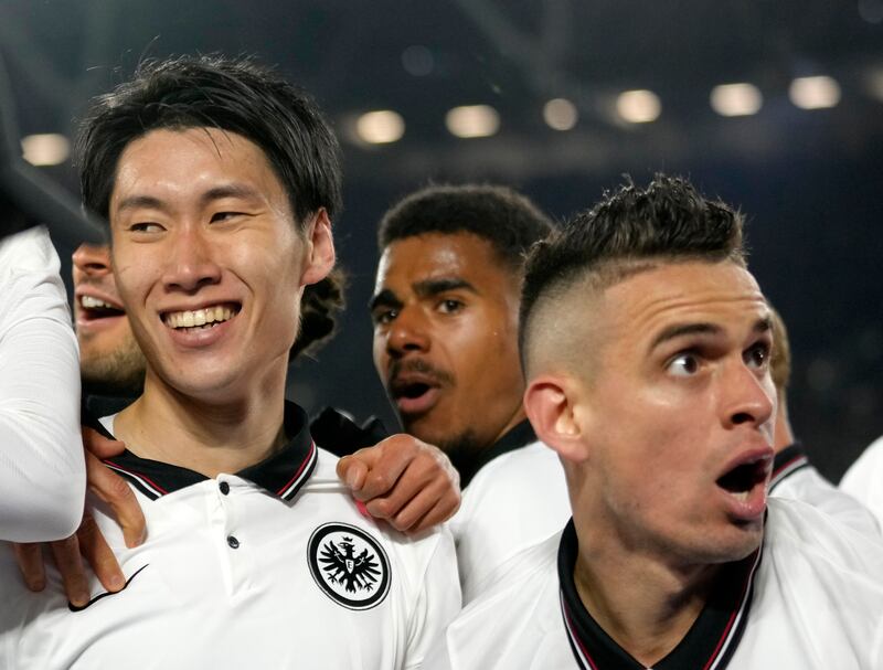 Frankfurt's Daichi Kamada (l) celebrates with teammates after scoring his side's second goal. AP