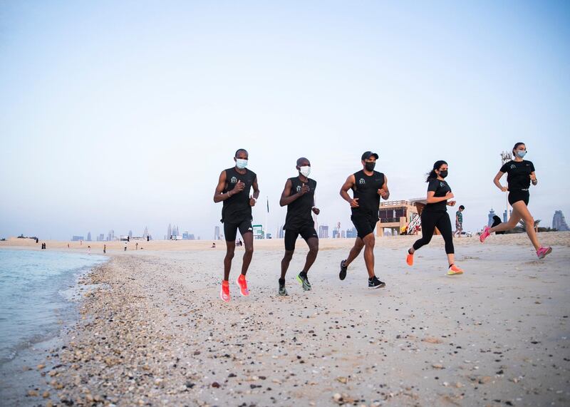 DUBAI, UNITED ARAB EMIRATES.  23 FEBRUARY 2021. 
From right to left, Charles Rotich, Dennis Okwanga, and trainer Suleiman Baboo, train at Jumeirah's beach, 

Charles Rotich works as a pest-controller, grew up with the world’s top runner Eliud Kipchoge and they used to run together in the streets of Kenya as teenagers.

Photo: Reem Mohammed / The National
Reporter: Haneen Dajani
Section: NA