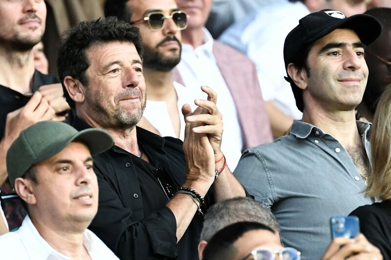 French actor and singer Patrick Bruel applauds at Parc des Princes Stadium. AFP