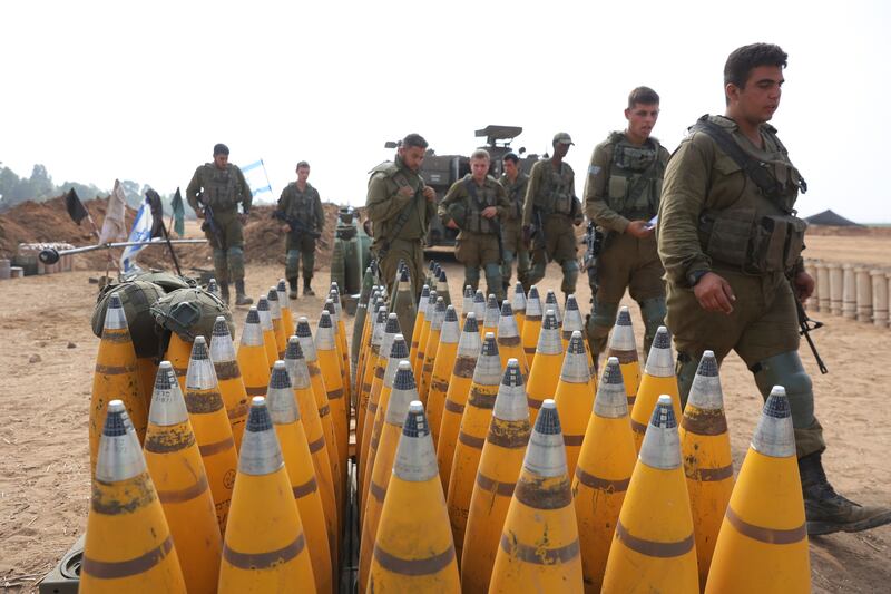 Israeli soldiers preparing ammunition near the Gaza border. EPA