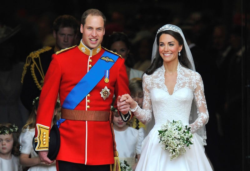 Britain's Prince William (L) and Catherine, Duchess of Cambridge, are seen walking after their wedding ceremony in Westminster Abbey in central London in this April 29, 2011 file photograph. Britain's Prince William and his wife Catherine are expecting a baby, the prince's office said on December 3, 2012.    (ROYAL WEDDING/VIP)   REUTERS/Toby Melville/Files   (BRITAIN - Tags: ENTERTAINMENT SOCIETY ROYALS TPX IMAGES OF THE DAY)