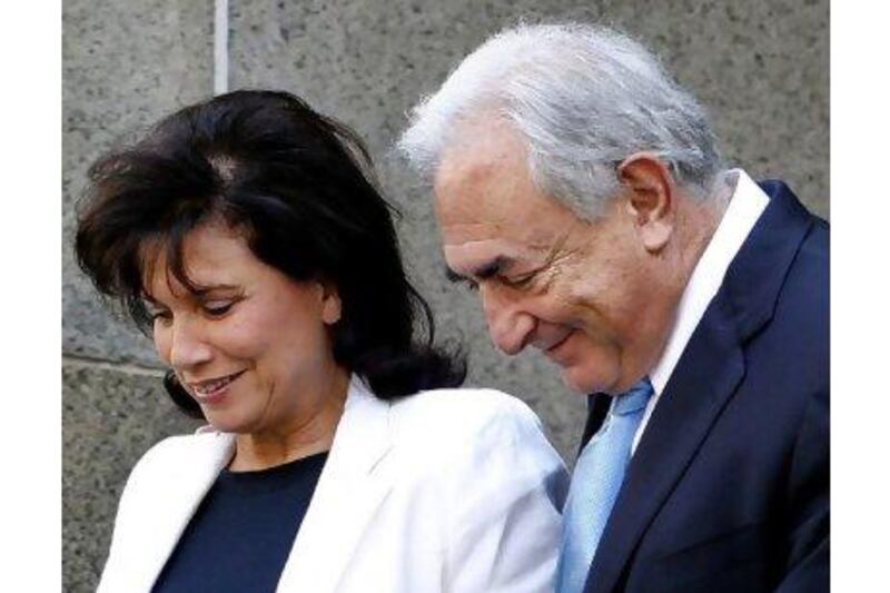 Former International Monetary Fund leader Dominique Strauss-Kahn leaves New York State Supreme court with his wife Anne Sinclair on Friday.