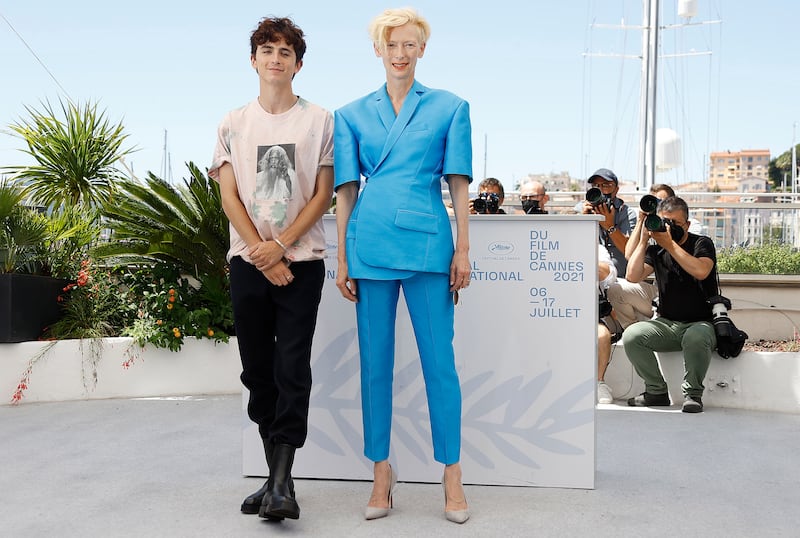Timothee Chalamet and Tilda Swinton attend a photo call for 'The French Dispatch' at the 74th annual Cannes Film Festival on July 13, 2021