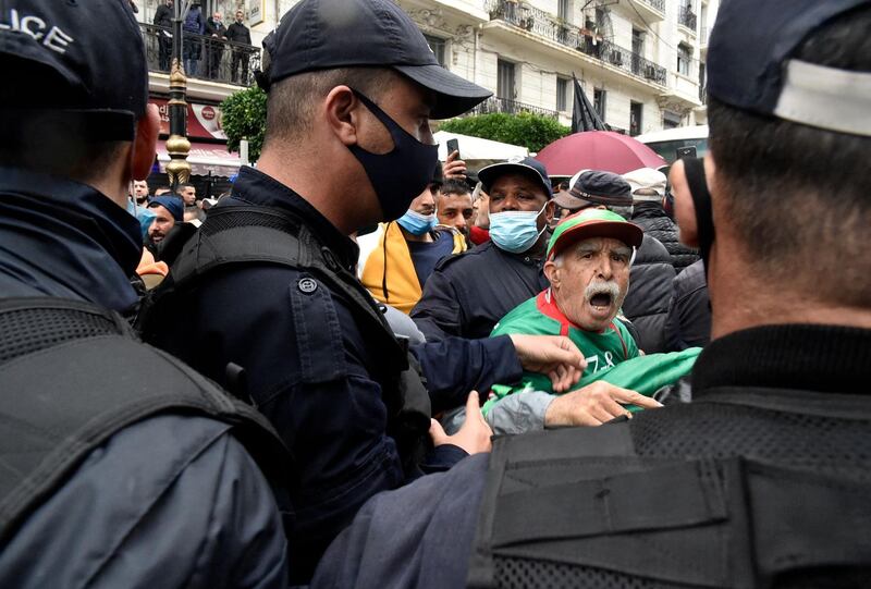 An elderly man confronts police officers during a demonstration in the Algerian capital Algiers, marking the second anniversary of the country’s anti-government Hirak protest movement. AFP