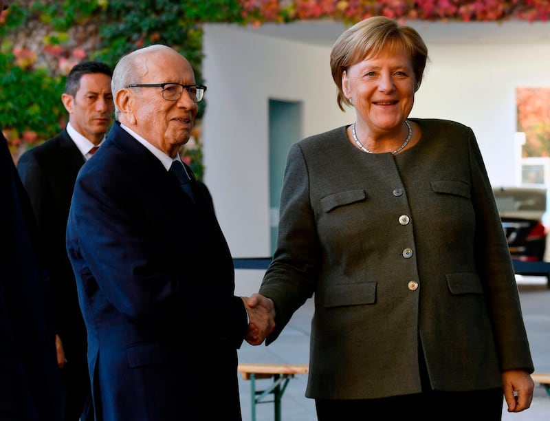 German Chancellor Angela Merkel welcoming Tunisia's President Beji Caid Essebsi on the sidelines of the "Compact with Africa" conference in October 2018. AFP