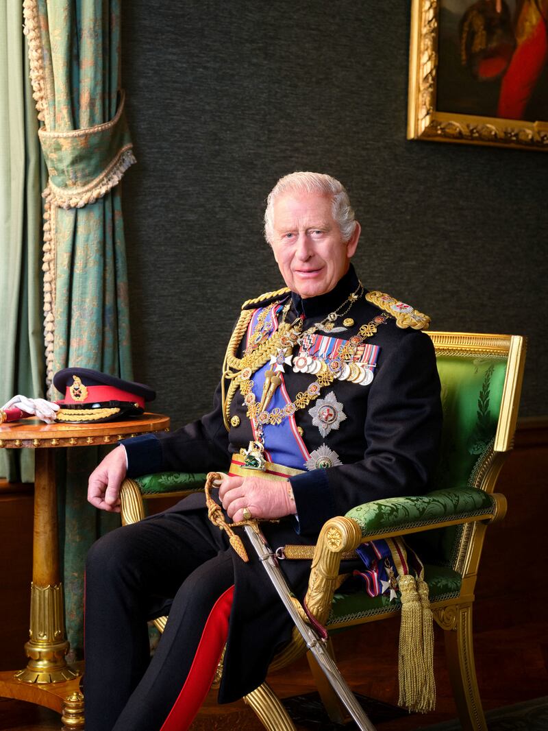 Britain's King Charles III poses for a picture while wearing his field marshal No1 full ceremonial frock coat with medals, sword and decorations. Reuters